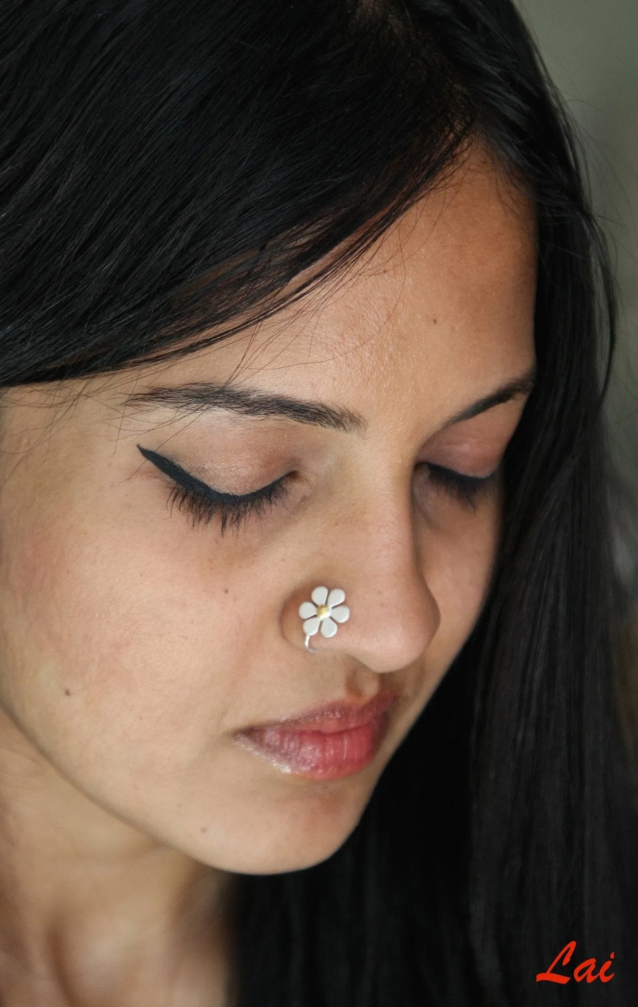 Elegant, dual-tone floral nose pin